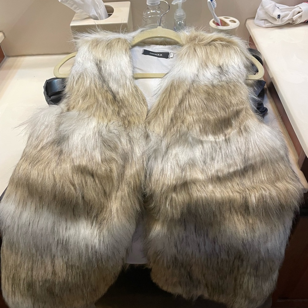Multi tone fur vest!  Very fun piece!  Great for fall weather!